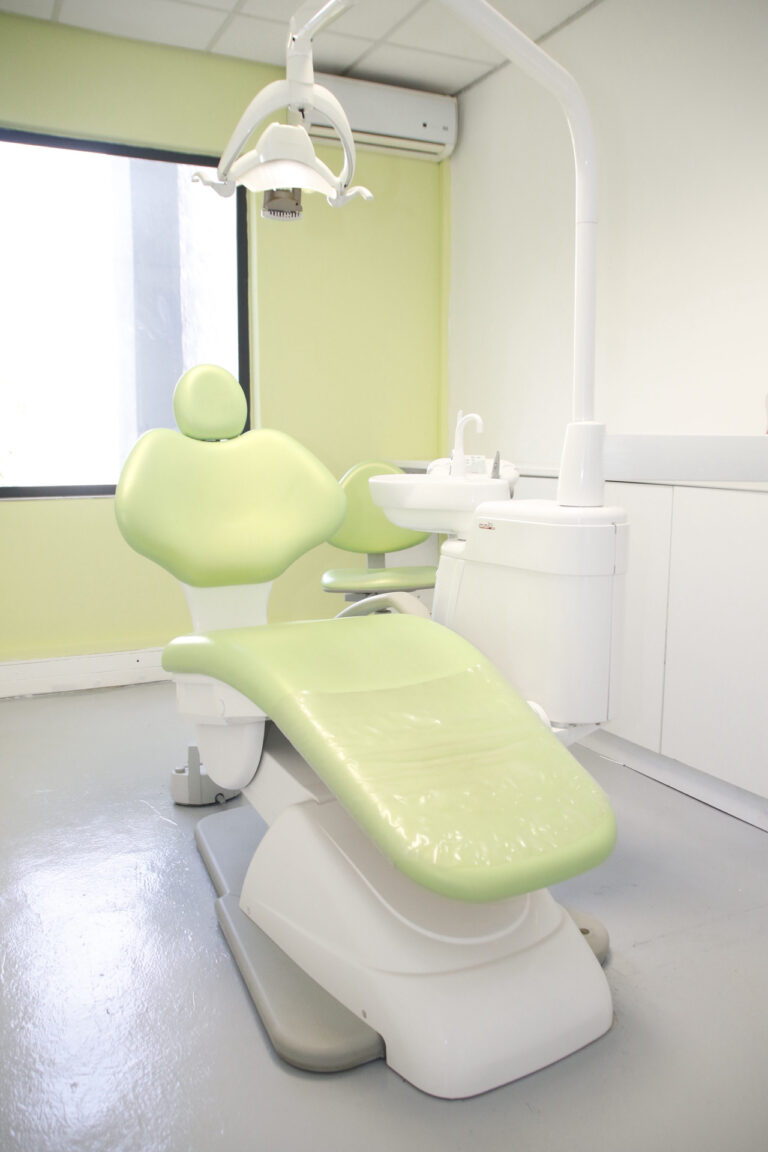 Modern dental chair in a clean and bright dental clinic with advanced equipment.