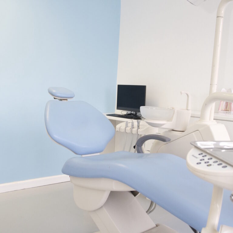 Modern dental chair in a clean and bright dental clinic with advanced equipment.